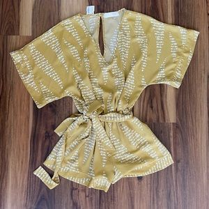 NWT Frock Candy Romper Size Small. So cute on, just didn’t need it!